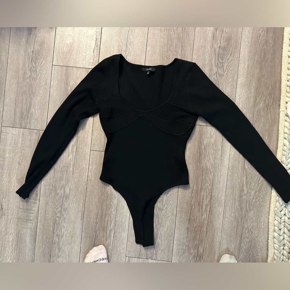 Black sweater body suit.